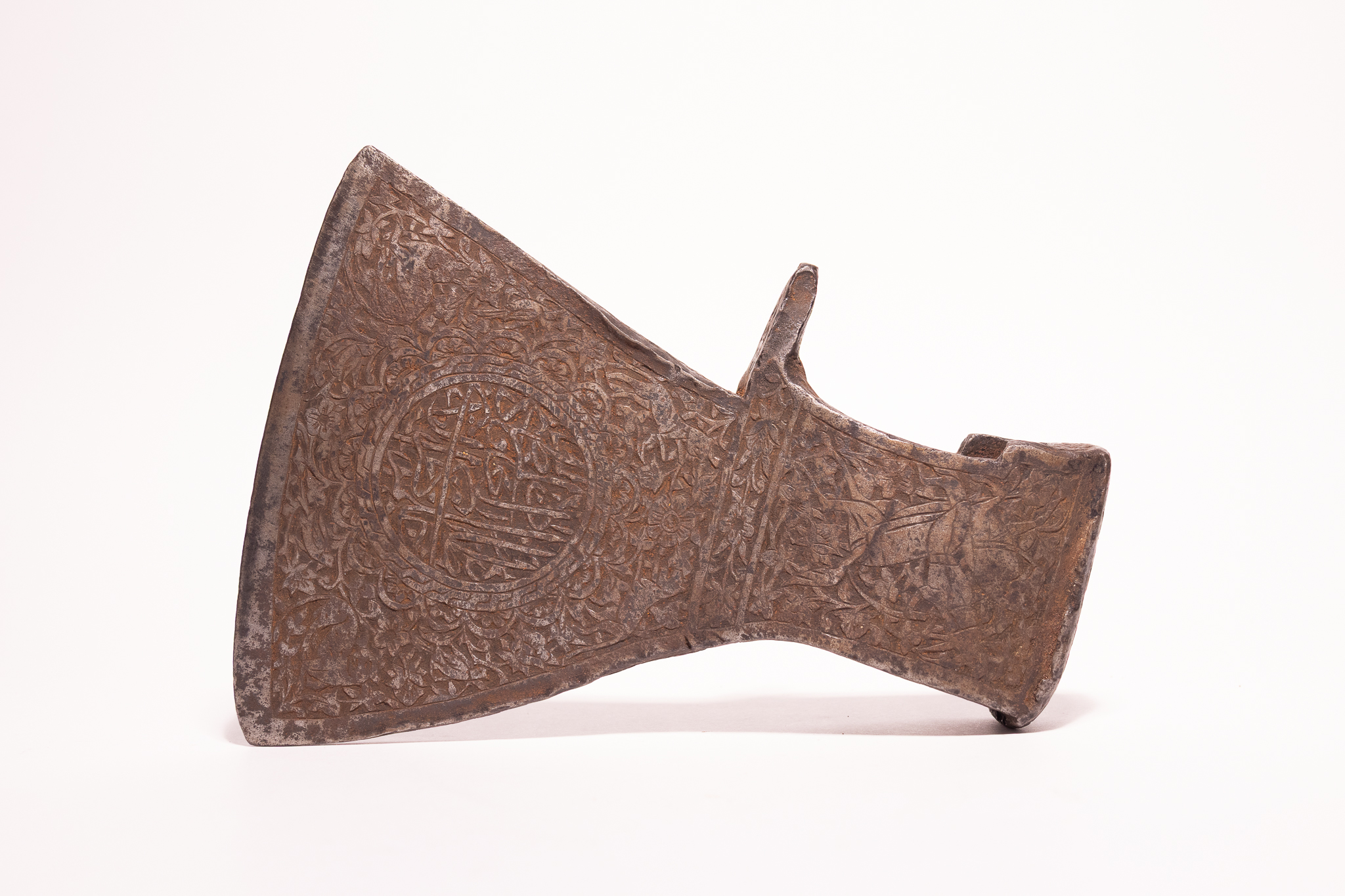 A QAJAR CALLIGRAPHIC STEEL AXE HEAD (TABAR), 19TH-20TH CENTURY.