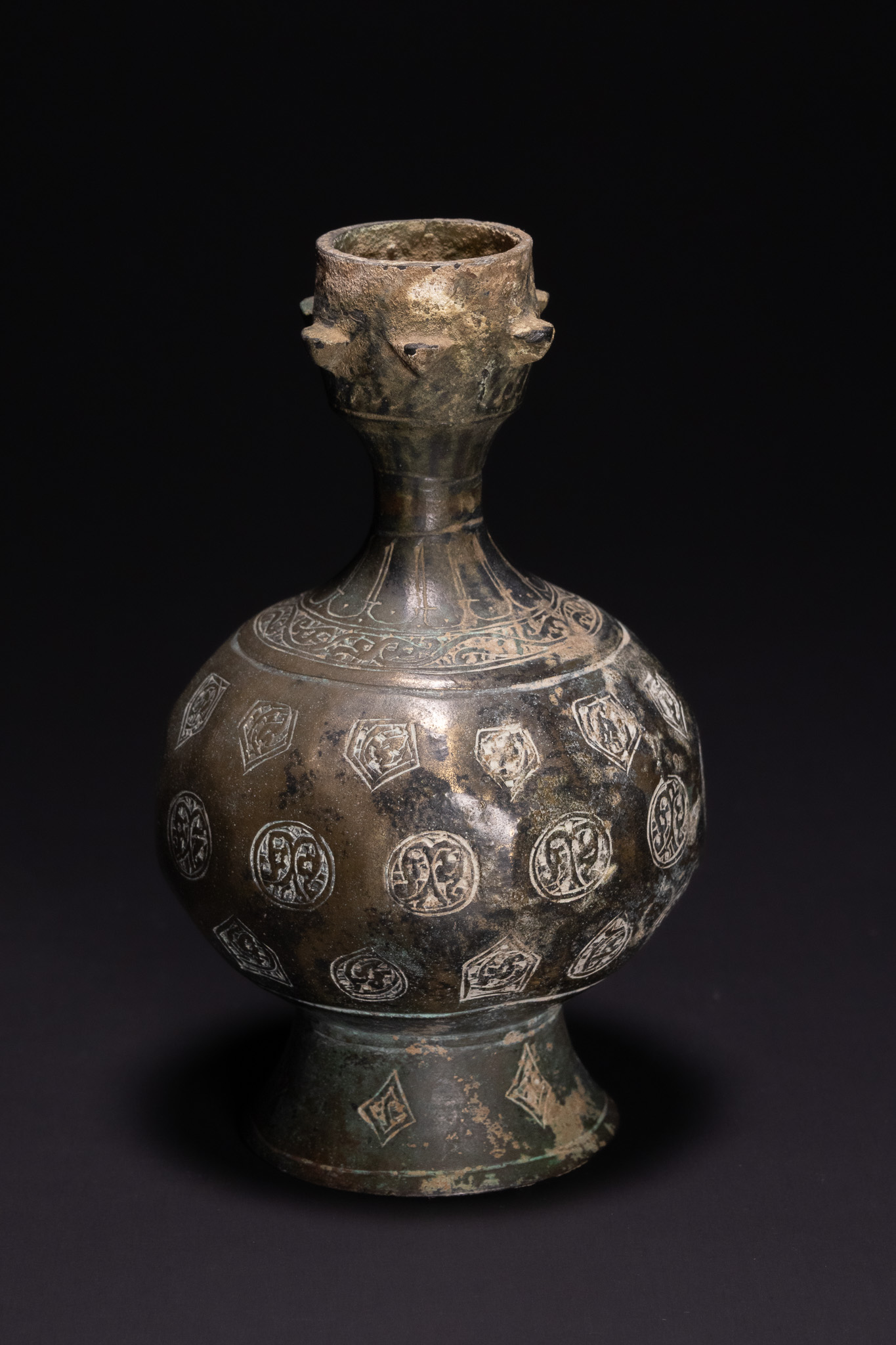 A SELJUK INLAID BRONZE ROSEWATER SPRINKLER, 12TH CENTURY.