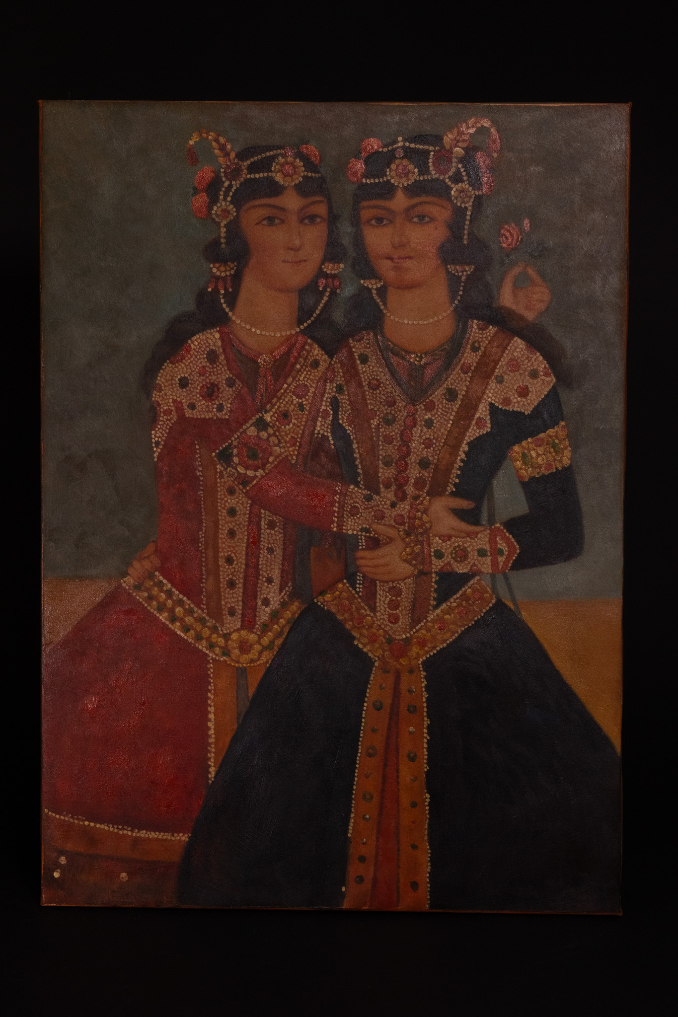 A QAJAR STYLE PORTRAIT OF TWO SISTERS OIL ON CANVAS, POSSIBLY 19TH CENTURY.
