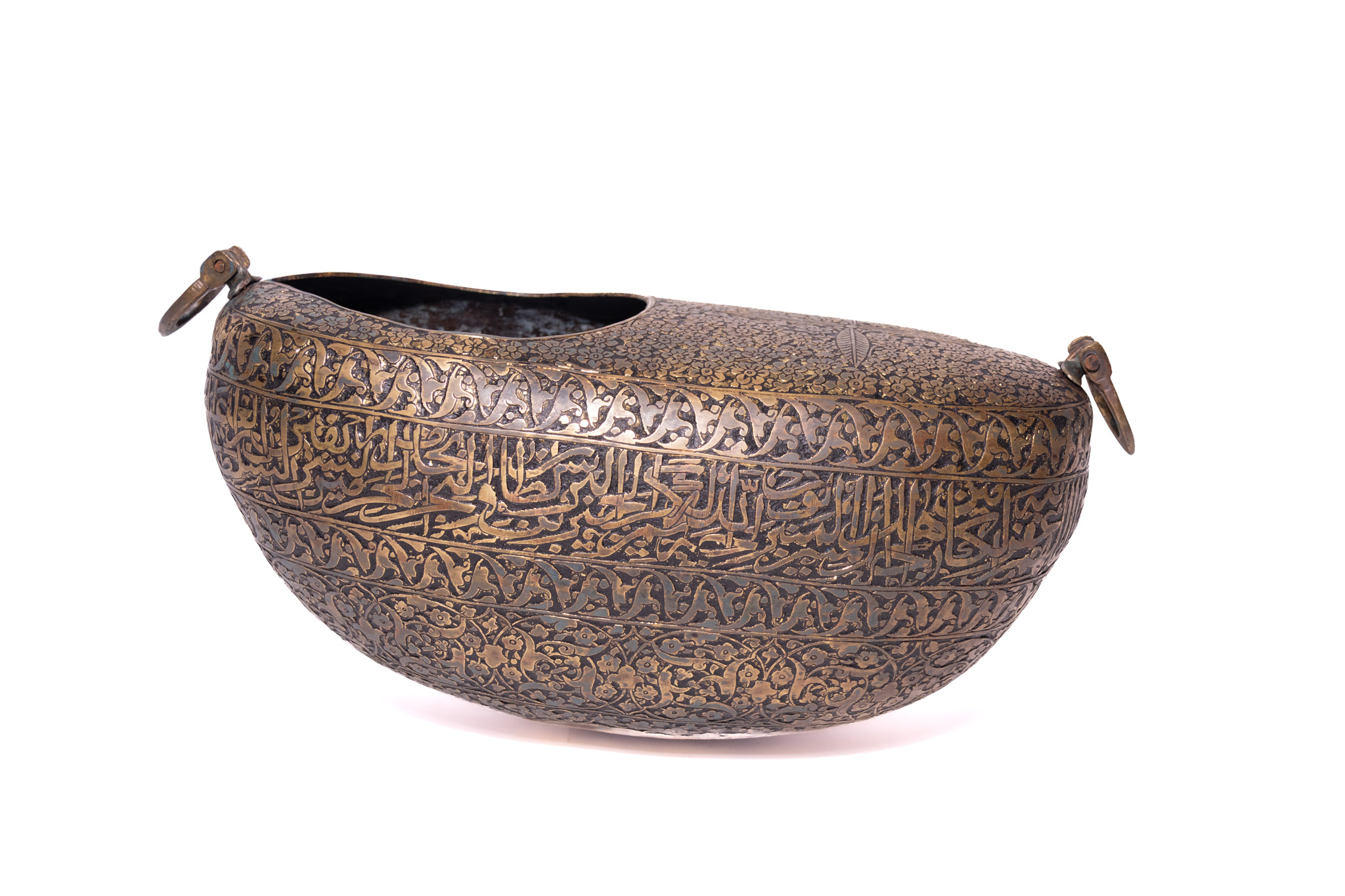 A QAJAR ENGRAVED BRASS BEGGARS BOWL KASHKUL 19TH CENTURY.