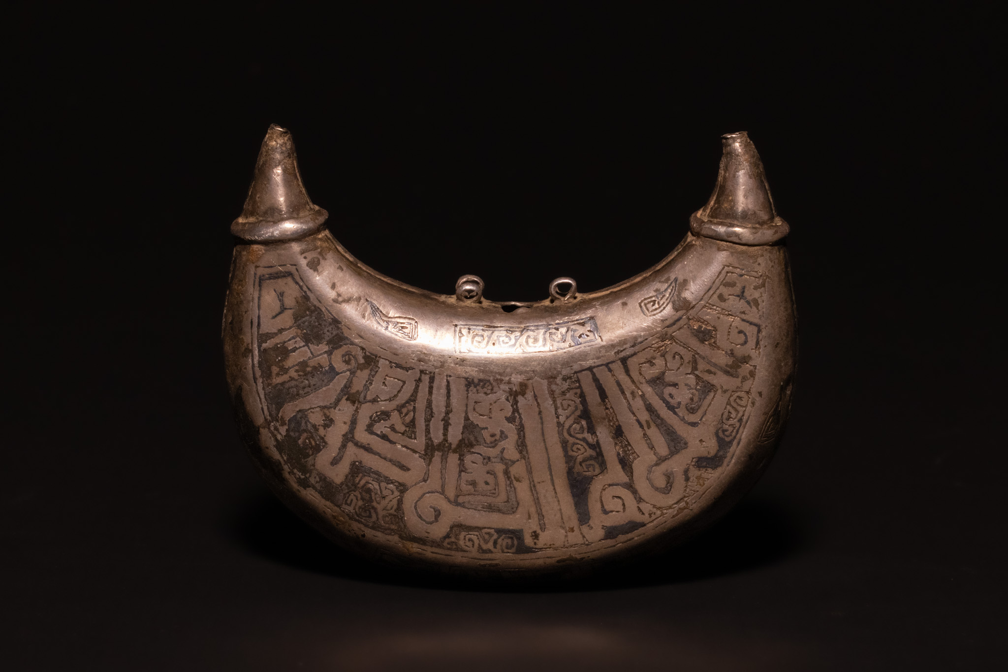 A SELJUK SILVER AND NIELLO PECTORAL PENDANT, PERSIA, 12TH CENTURY.