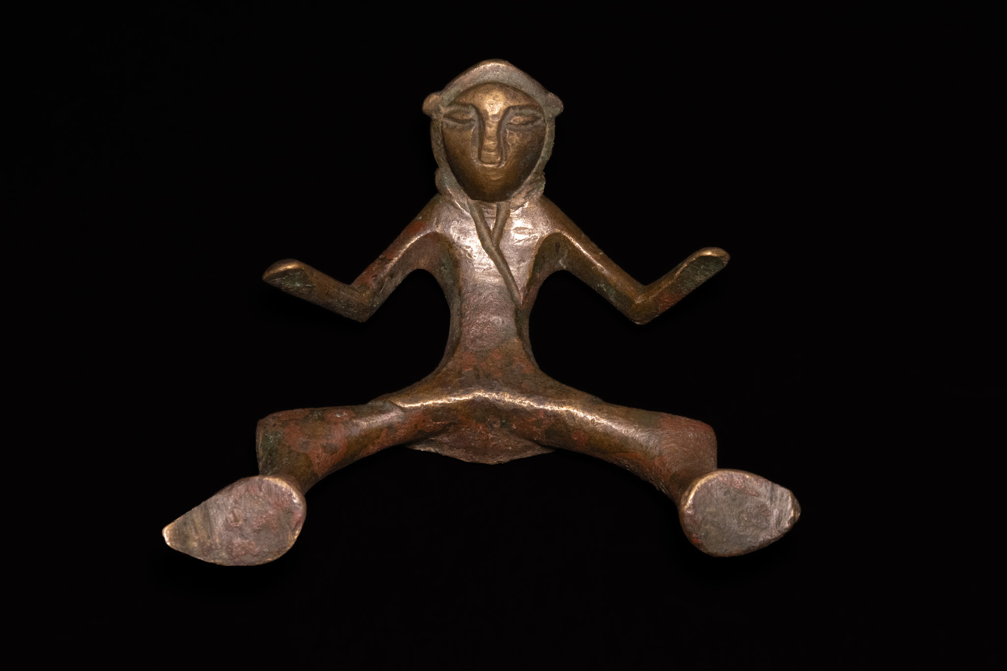 A SELJUK SILVER-INLAID BRONZE FIGURAL HANDLE, 12TH CENTURY.