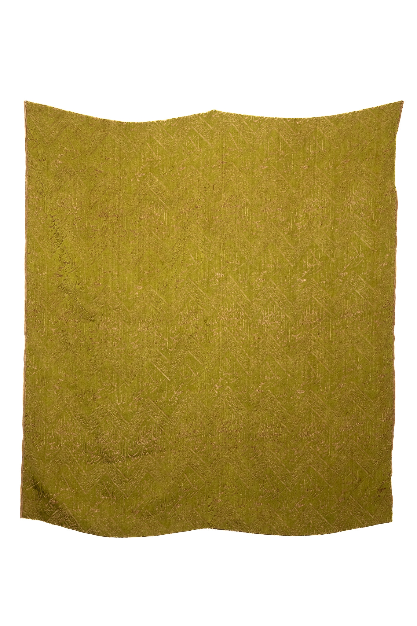 AN OTTOMAN FABRIC BROCADE FRAGMENT WITH WOVEN ARABIC CALLIGRAPHY, 20TH CENTURY.