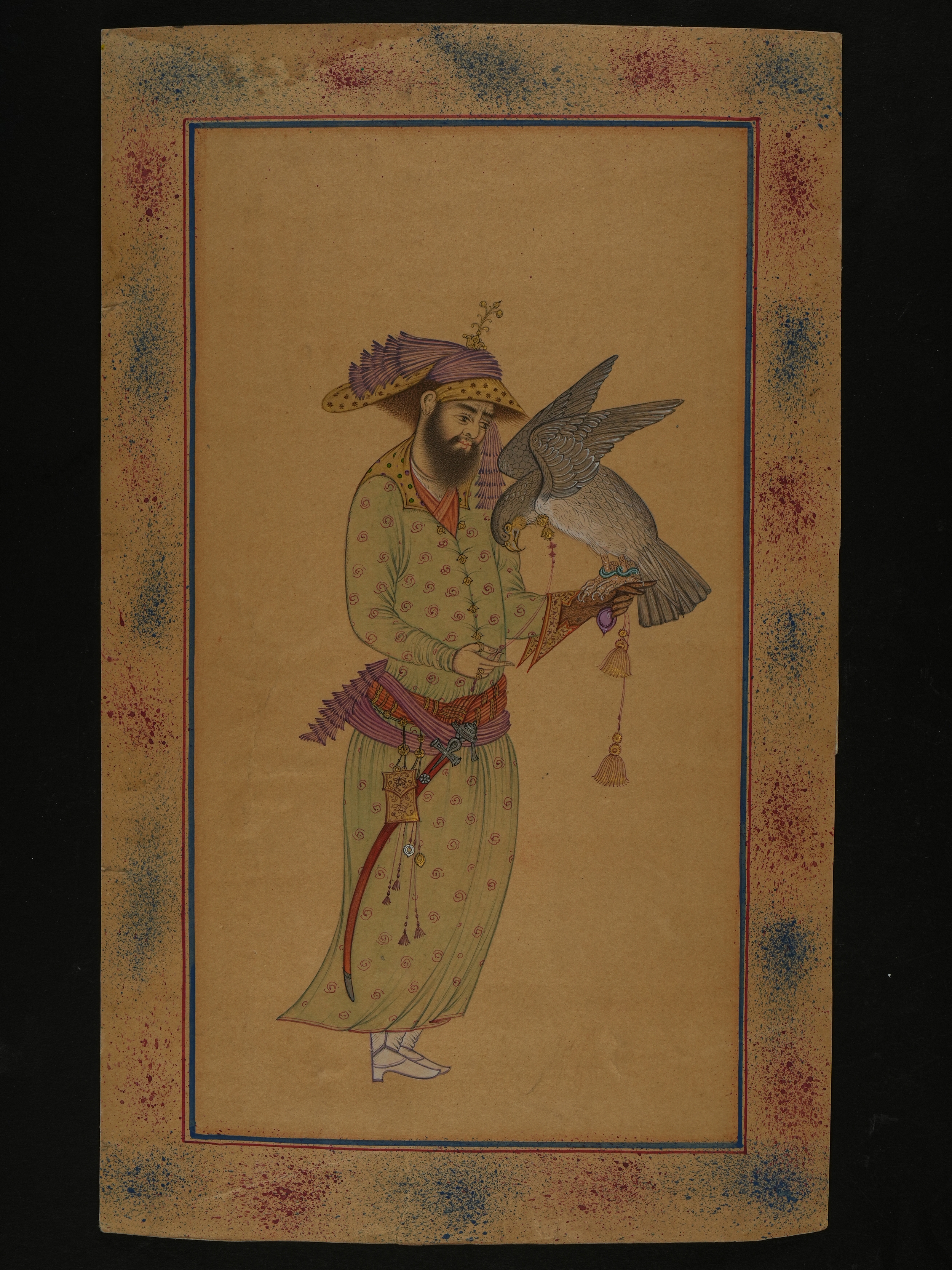 A PERSIAN MINIATURE PAINTING OF A FALCONER WITH HOODED HAWK, 18TH-19TH CENTURY.