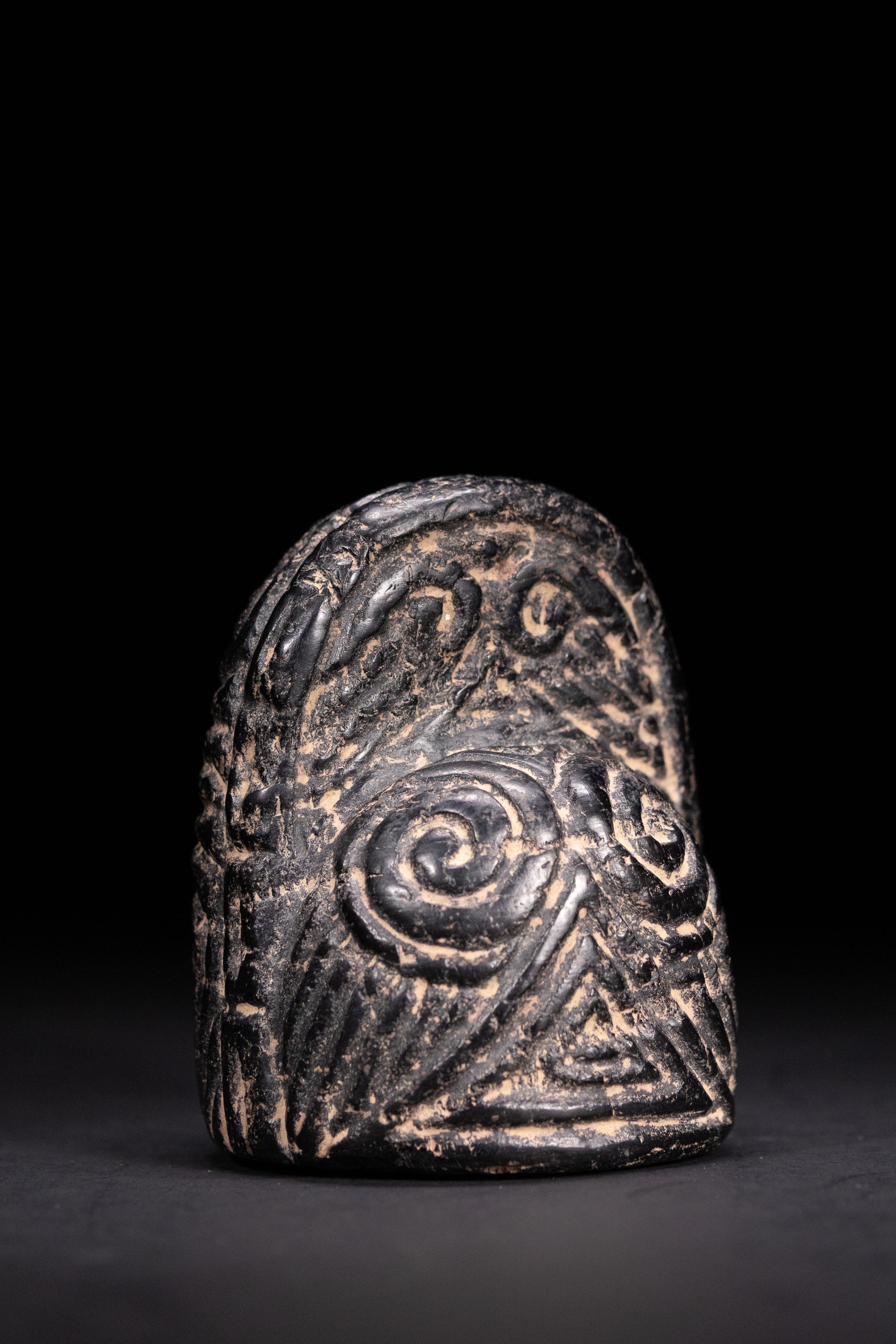 A FATIMID JET KING OR QUEEN CHESS PIECE, 11TH–13TH CENTURY.