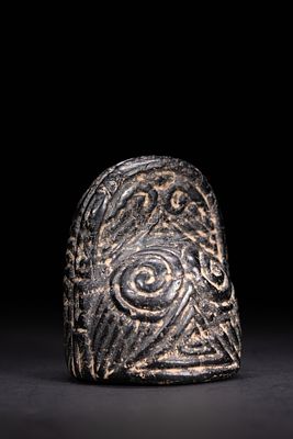 A FATIMID JET KING OR QUEEN CHESS PIECE, 11TH–13TH CENTURY. This jet-black chess piece features 