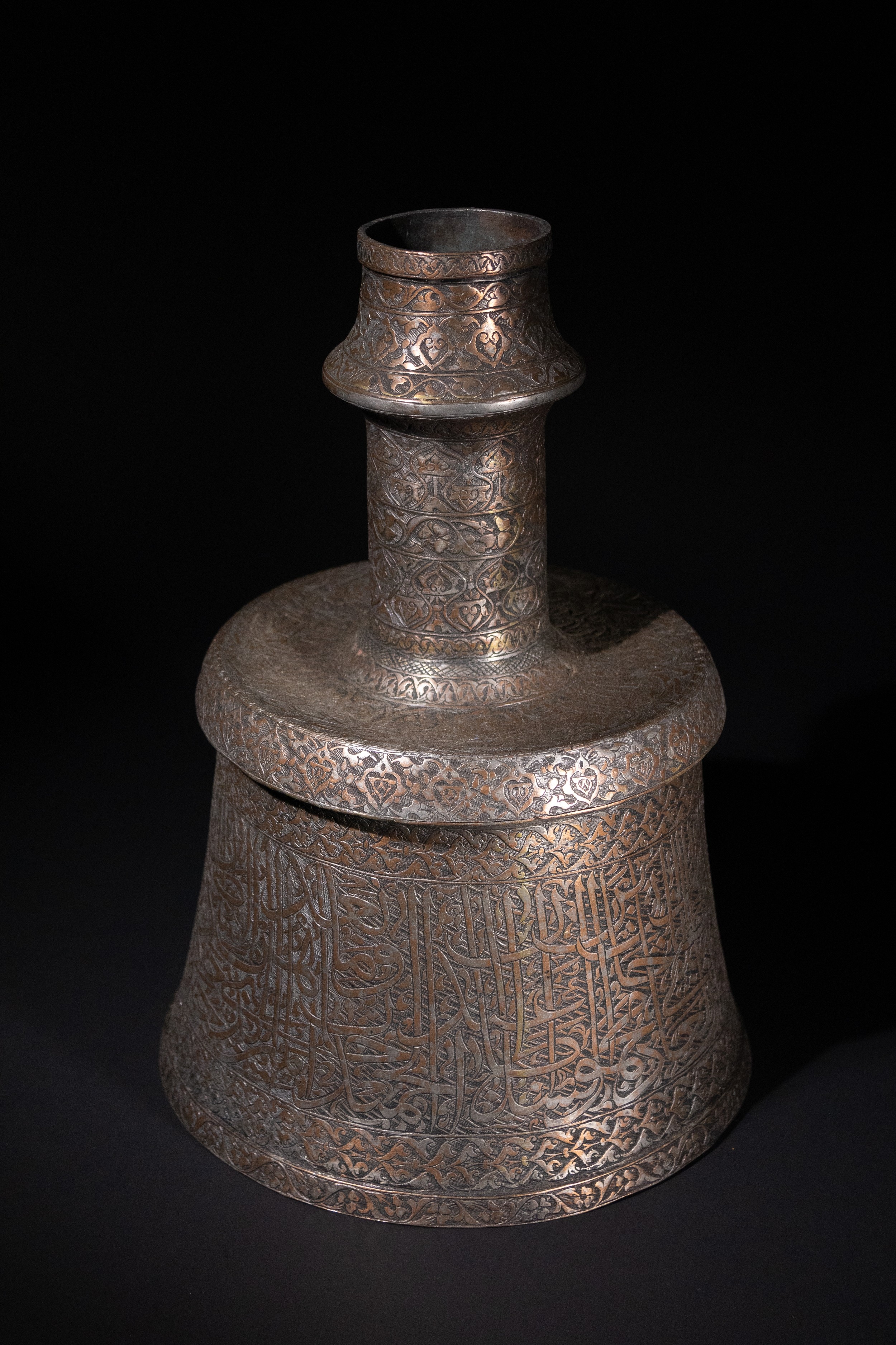 A MAMLUK COPPER CALLIGRAPHIC CANDLESTICK, 14TH–15TH CENTURY.