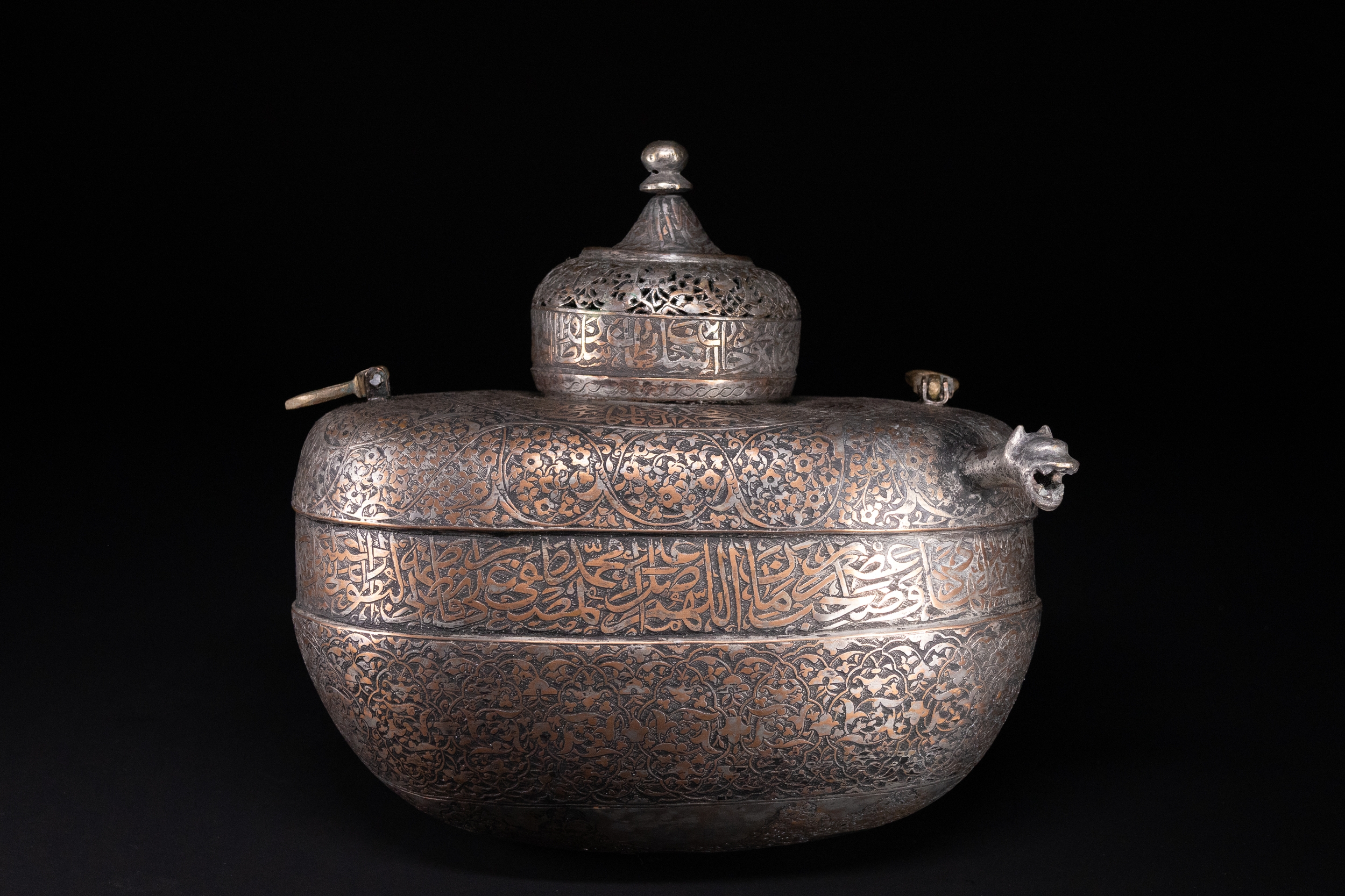 A RARE SAFAVID TINNED COPPER LIDDED KASHKUL BEGGAR'S BOWL WITH ARABIC INSCRIPTIONS, 17TH CENTURY.