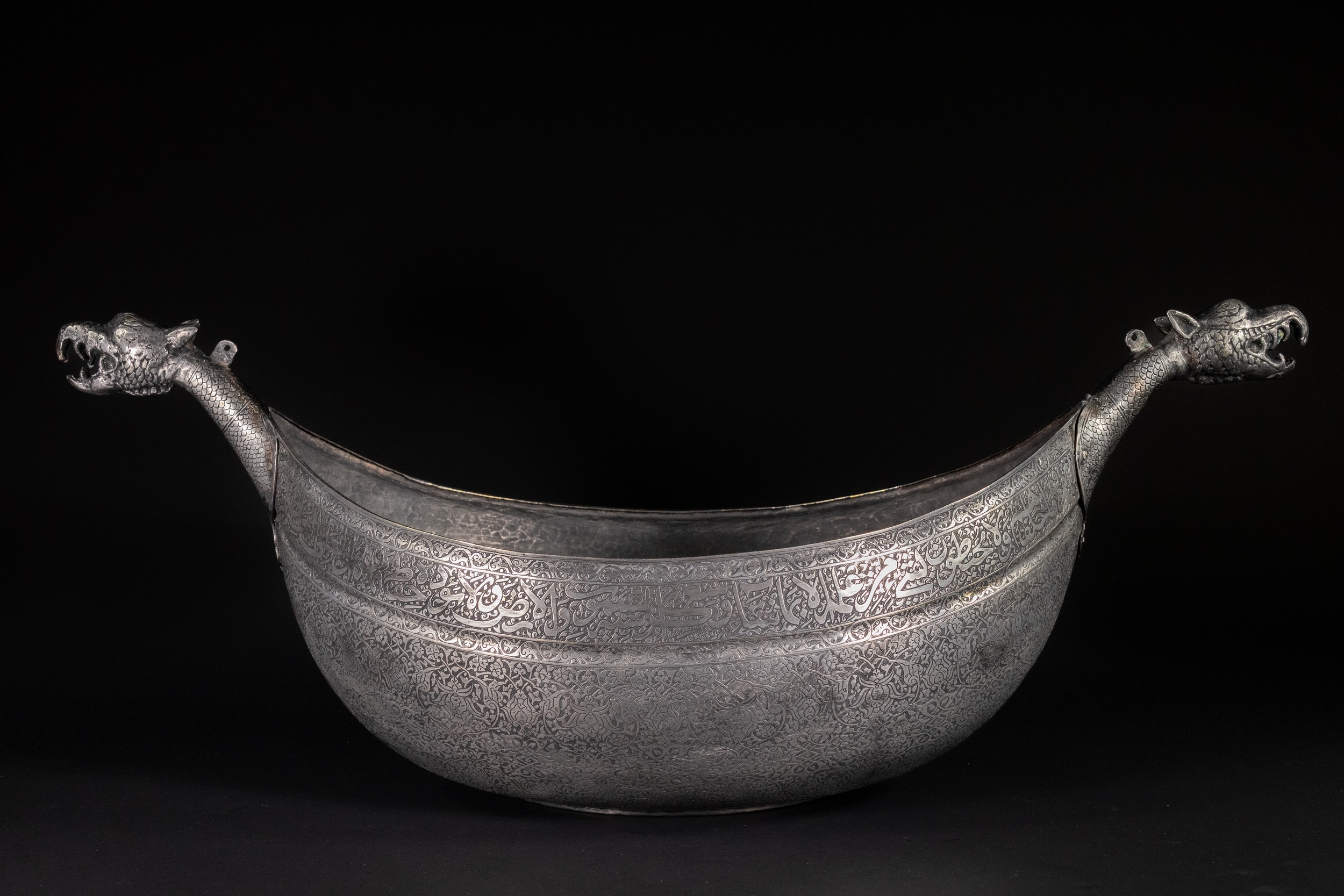 A LARGE TIMURID TINNED COPPER KASHKUL BEGGAR'S BOWL, 15TH CENTURY OR LATER.