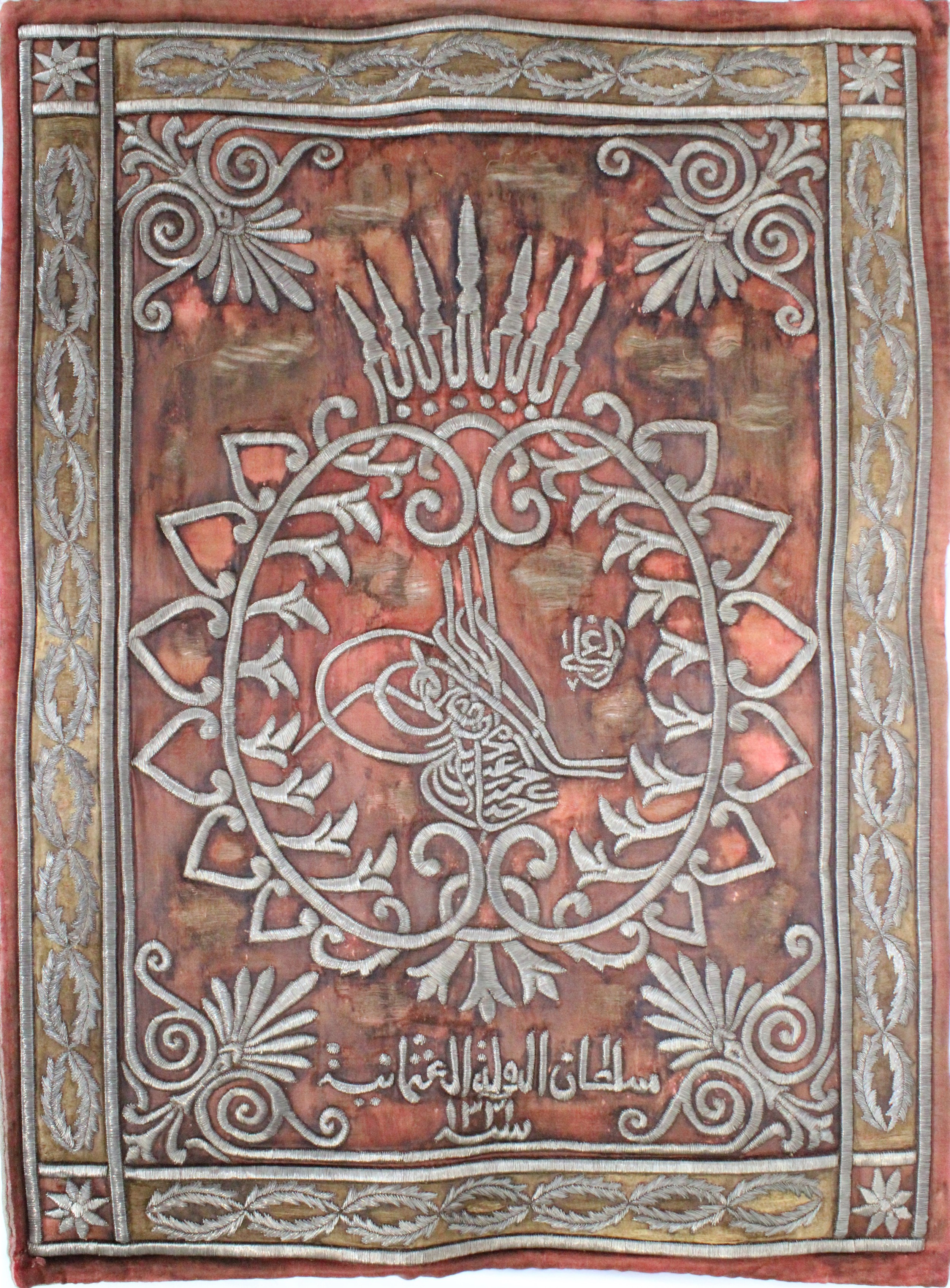 AN OTTOMAN METAL-THREAD EMBROIDERED CURTAIN WITH TUGHRA, 19TH CENTURY.