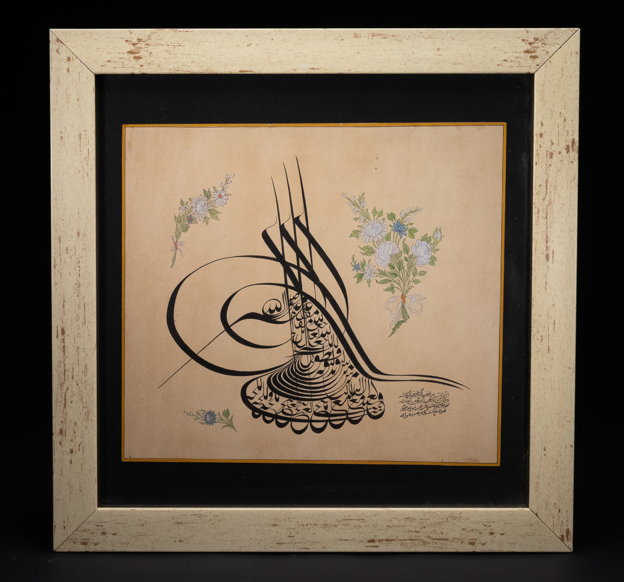 AN OTTOMAN CALLIGRAPHIC TUGHRA WITH POLYCHROME FLORAL DECORATION, 20TH CENTURY.