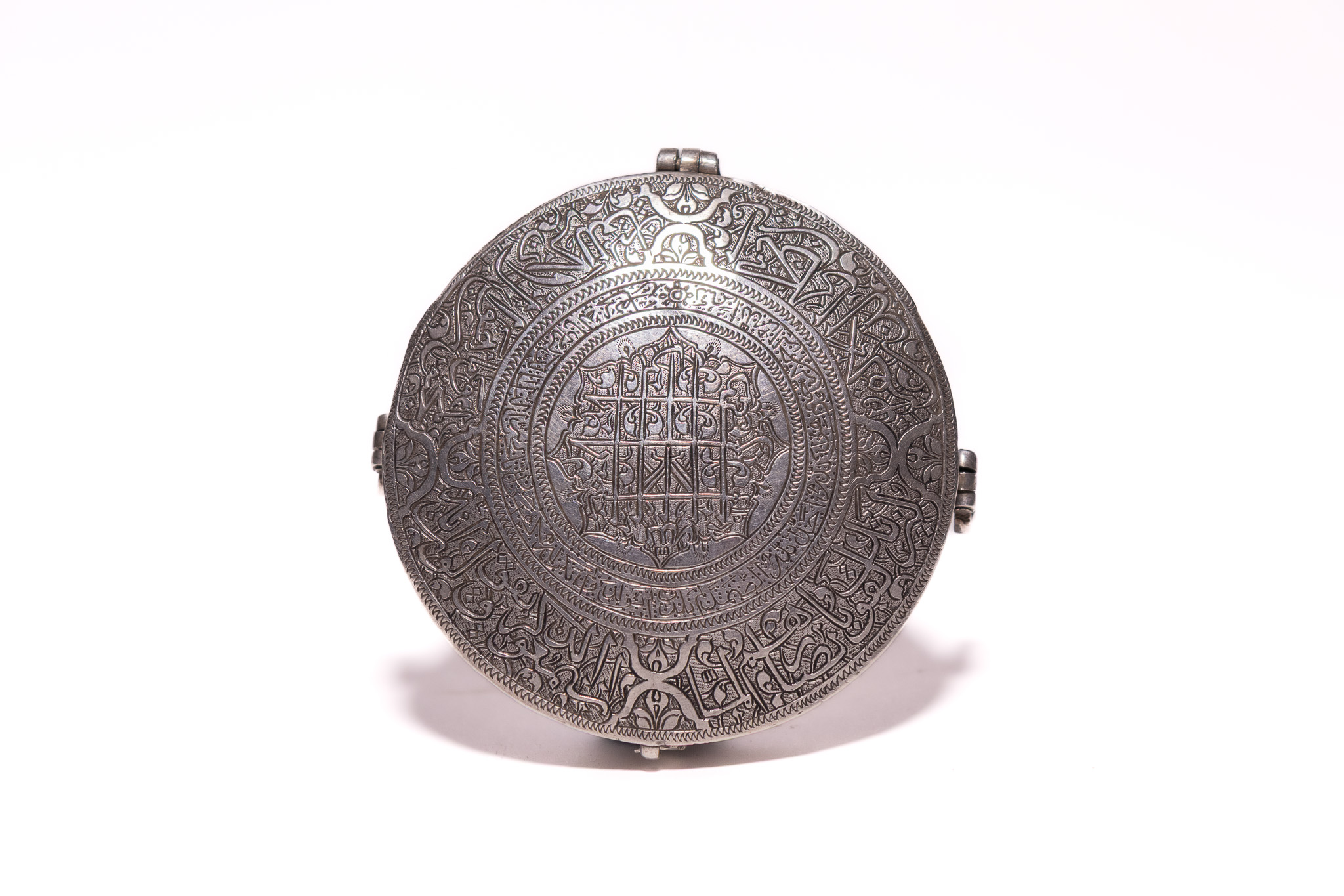 AN ISLAMIC ZAND ENGRAVED SILVER TALISMANIC QURAN BOX.