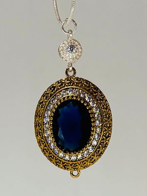 תליון מוזהב ומשובץ, 4.5x2.5 ס״מ, על שרשרת כסף 925 באורך 60 ס״מ, חתומה