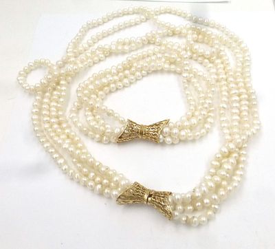 Pearl necklace 4 lines with 14K gold clasp. and bracelet 4 lines of pearls with 14K gold clasp