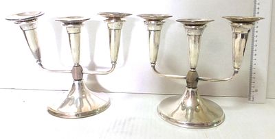Pair of silver 800 candlesticks, each with three arms. with wooden bead in the center, Poland 