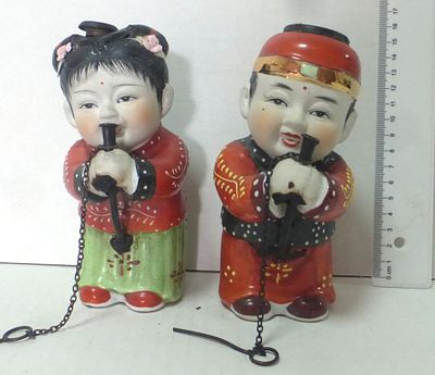 Pair of porcelain figurine used for opium smoking. Japan or China, first half of 20th century 
