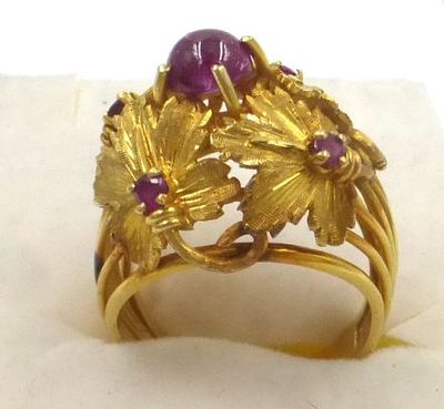 18K gold ring shaped like vine leaves. set with ruby cabochon and 4 small rubbies size 12 (US 6) 