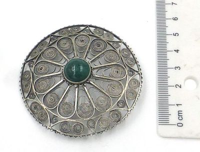 Round sterling silver pin. With filigree, set with green carnelian, diameter 6 cm, 19.5 gm