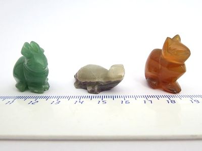 Three jade figurines,. rabbit, cat and tortoise