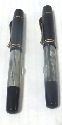Two fountain pens by Pelikan, Germany. model 100N, the 1930's, body green-gray marble shade, 14K 