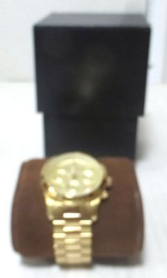 Wrist watch by Michael Kors, Chronograph type,. with date, quartz mechanism, bracelet and box 