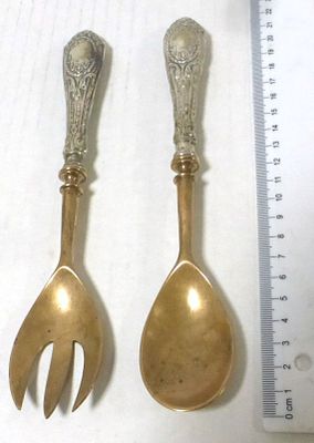Pair of serving tools, spoon and fork. only the handles are silver