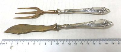 Pair of serving tools, knife and fork. only the handles are silver