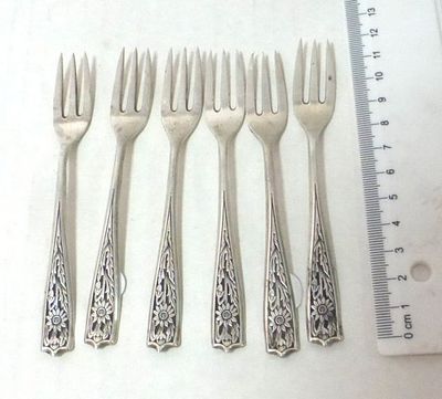 Six small silver forks. with relief on the handle, showing sun flowers, 80 gm