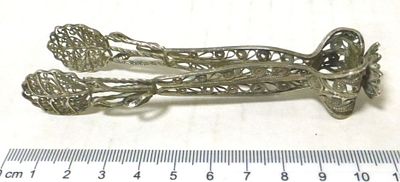 Small silver tongs with filigree. not marked, 22 gm