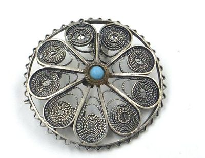 Round sterling silver pin. With filigree, set with turquoise, diameter 3.3 cm, 5.9 gm