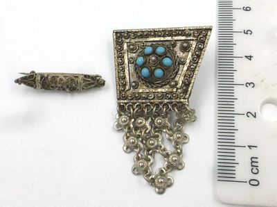 Two silver pins: a with filigree set with turquoises. in yemenite style b. with filigree shaped 