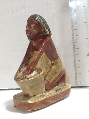 Replica of an Egyptian figurine. carved limestone, woman shape, height 11.5 cm