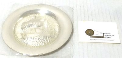 Memento saucer for Cyprus. with imprint showing antique merchant boat which was found in the sea 