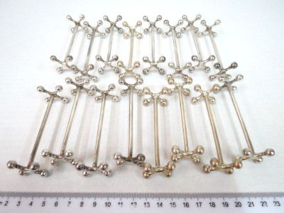 Sixteen silver plated knife holders, by Christofle
