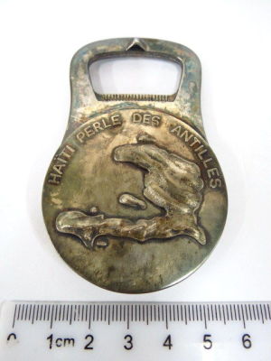 Bottle opener by Christofle, France, with map of Haiti, in original box,