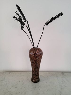 Glazed Vase with Black Decorative Stems. Glazed ceramic vase featuring a gold/brown and black 