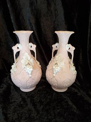 Pair of Ceramic Vases With Grape and Leaf Motifs. Pair of ceramic vases featuring raised grape 