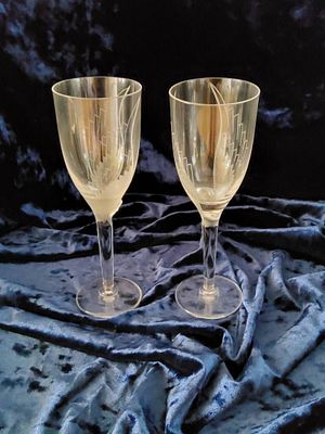 Pair of Etched Crystal Wine Glasses. A pair of etched crystal champagne flutes featuring elegant 