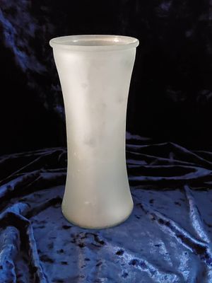 Frosted Glass Vase with Flared Design. A frosted glass vase featuring a flared design and smooth 