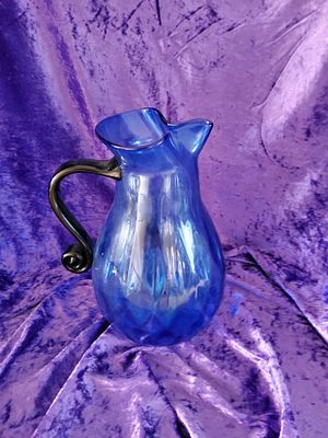 Blue Handblown Glass Pitcher with Black Handle. Handblown glass pitcher featuring a vibrant blue 