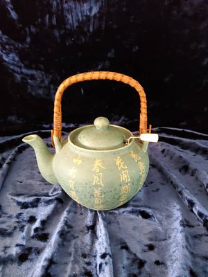 Green Ceramic Teapot With Bamboo Handle and Mesh Infuser. Green ceramic Oriental teapot 