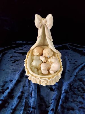 Lladro Porcelain Baby in Cradle Figurine. Lladro porcelain figurine depicting a baby sleeping in 