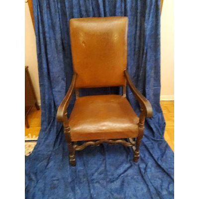 Brown Leather High-Back Armchair - Dark Wood Frame, Studded Trim, Vintage Style. This chair 