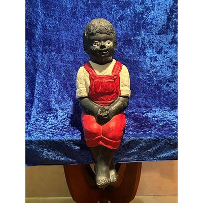 Concrete Boy Garden Statue - Red Overalls, Black Skin Tone, White Shirt, Sitting Figurine. This 