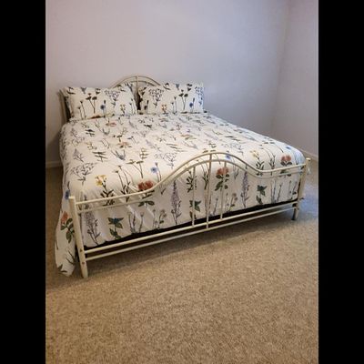 Metal King Bed Frame and Bedding Set. Metal bed frame and bedding set. Bed covering is in 