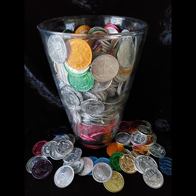 Large Glass Vase Filled with Assorted Mardi Gras Doubloons. Glass vase filled with decorative 