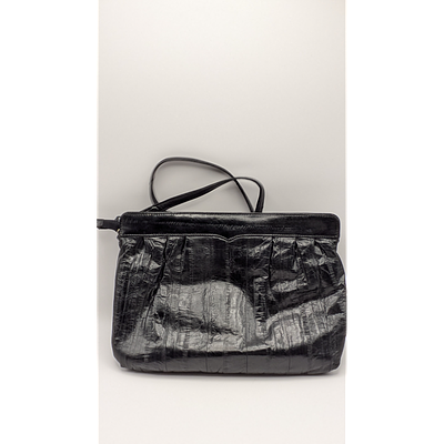 Black Clutch Purse. Description: Black clutch purse. Secure closure. Estimated Value: $10-20