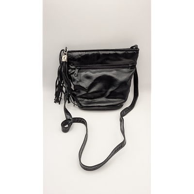 Black Leather Crossbody Bag with Tassels. Description: Black leather crossbody bag with tassel 