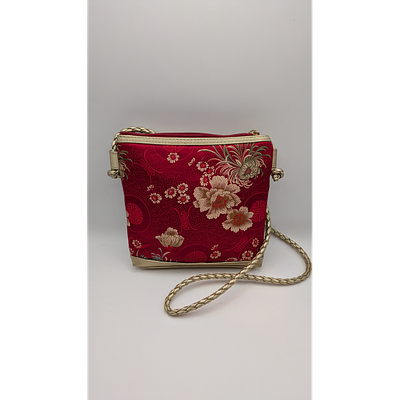 Tiannl Crossbody Bag - Floral, Braided Strap. Description: Tiannl red crossbody bag with a 