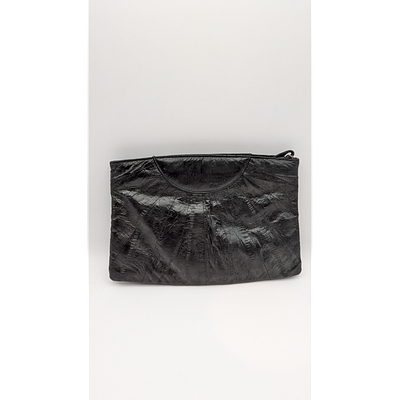 Clutch - Black. Description: Black leather clutch with a sleek design and secure closure. A 